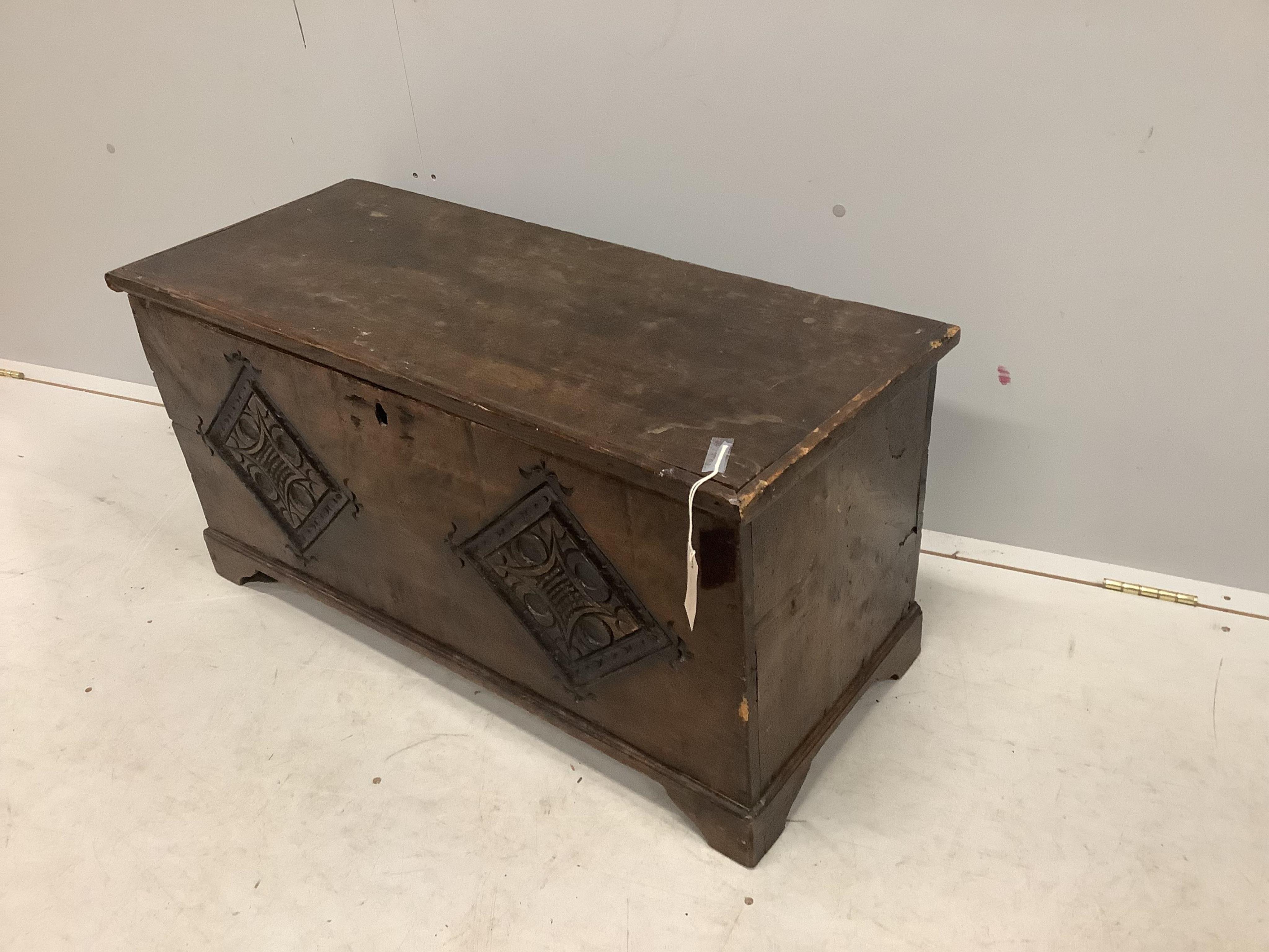 A small 17th century style carved fruitwood six plank coffer, width 91cm, depth 38cm, height 46cm. Condition - fair